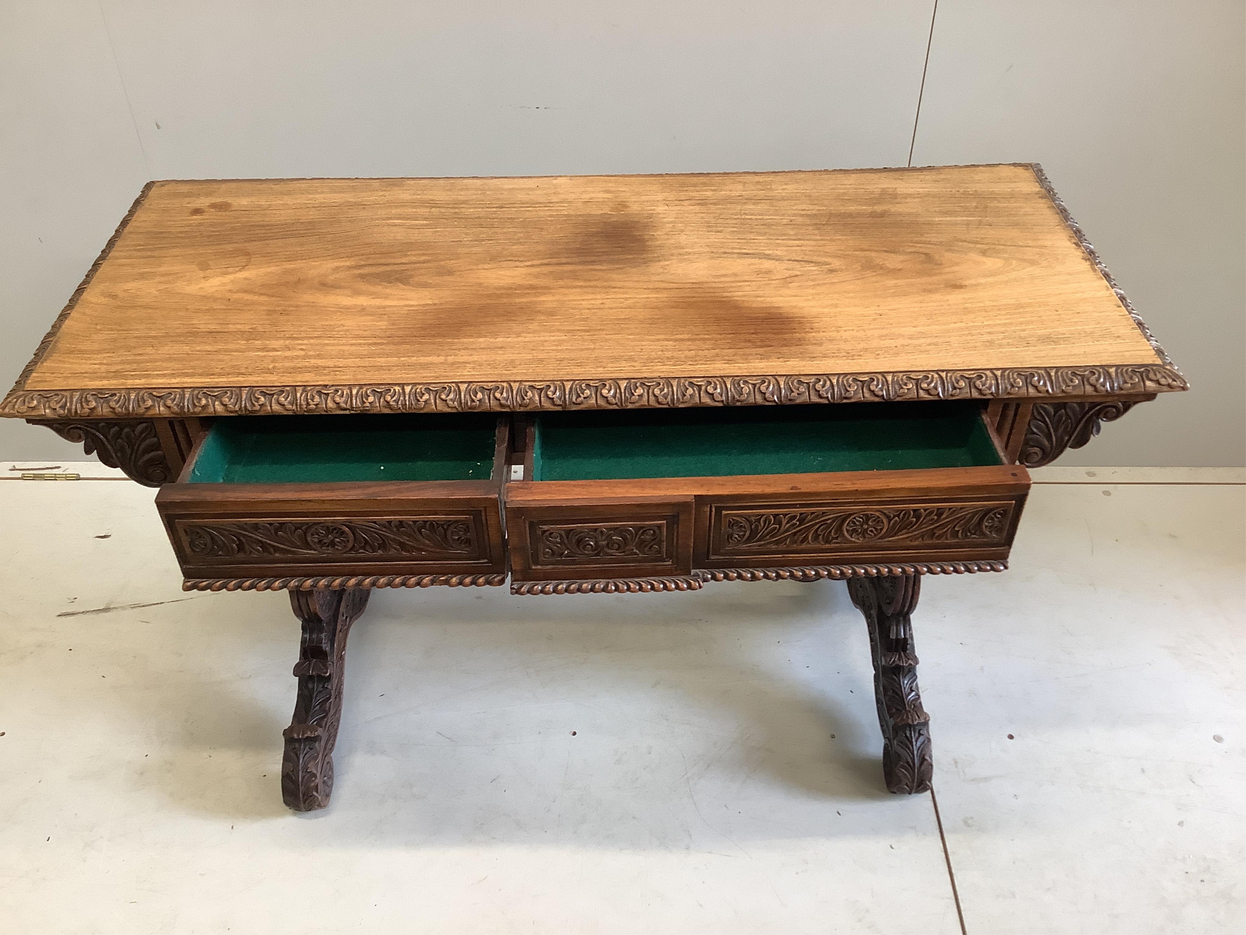 A 19th century Anglo Indian rosewood two drawer centre table, width 120cm, depth 50cm, height 75cm. Condition - fair